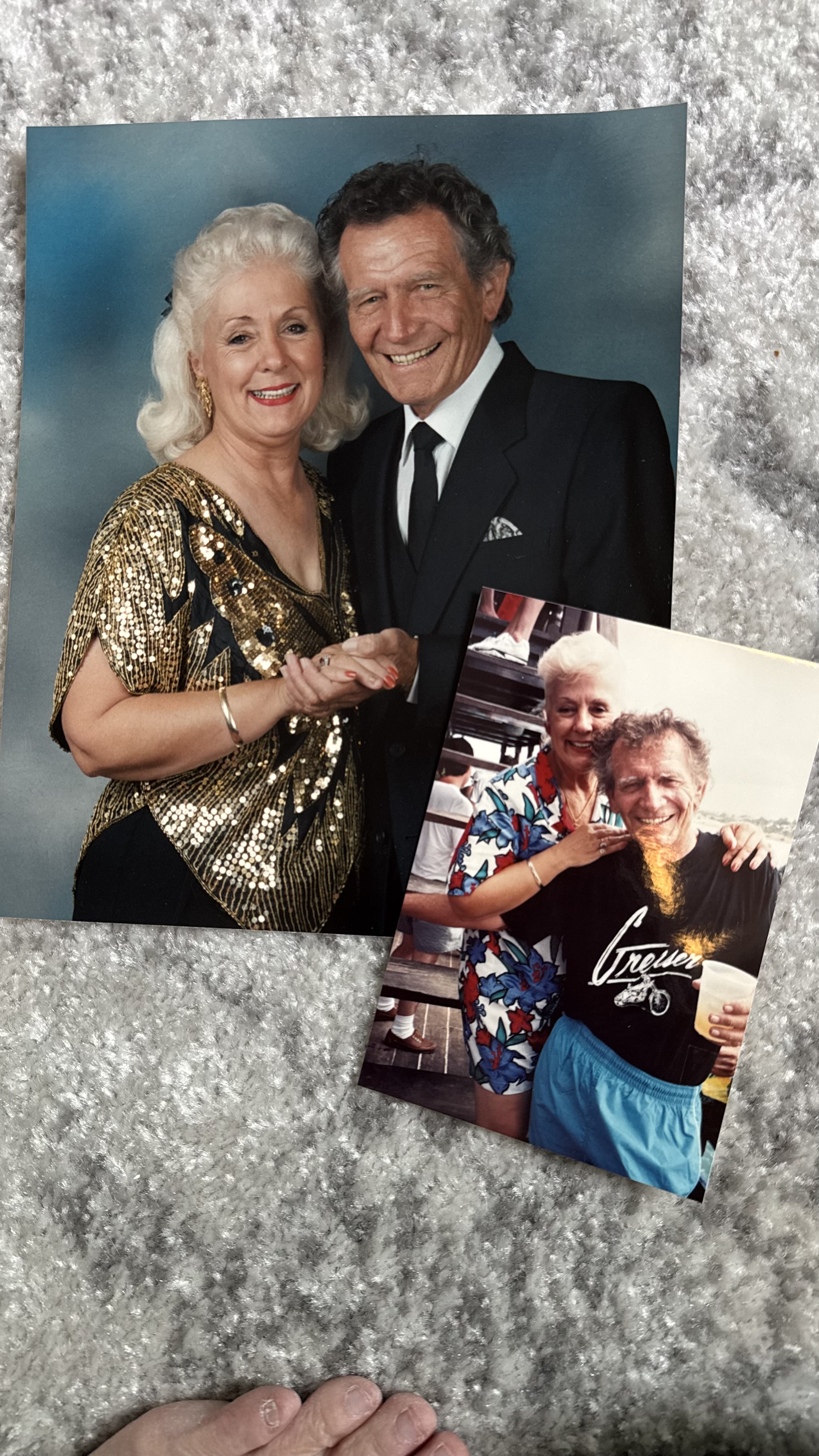 photograph of a smiling woman and her husband and a photograph of that man with his son.
