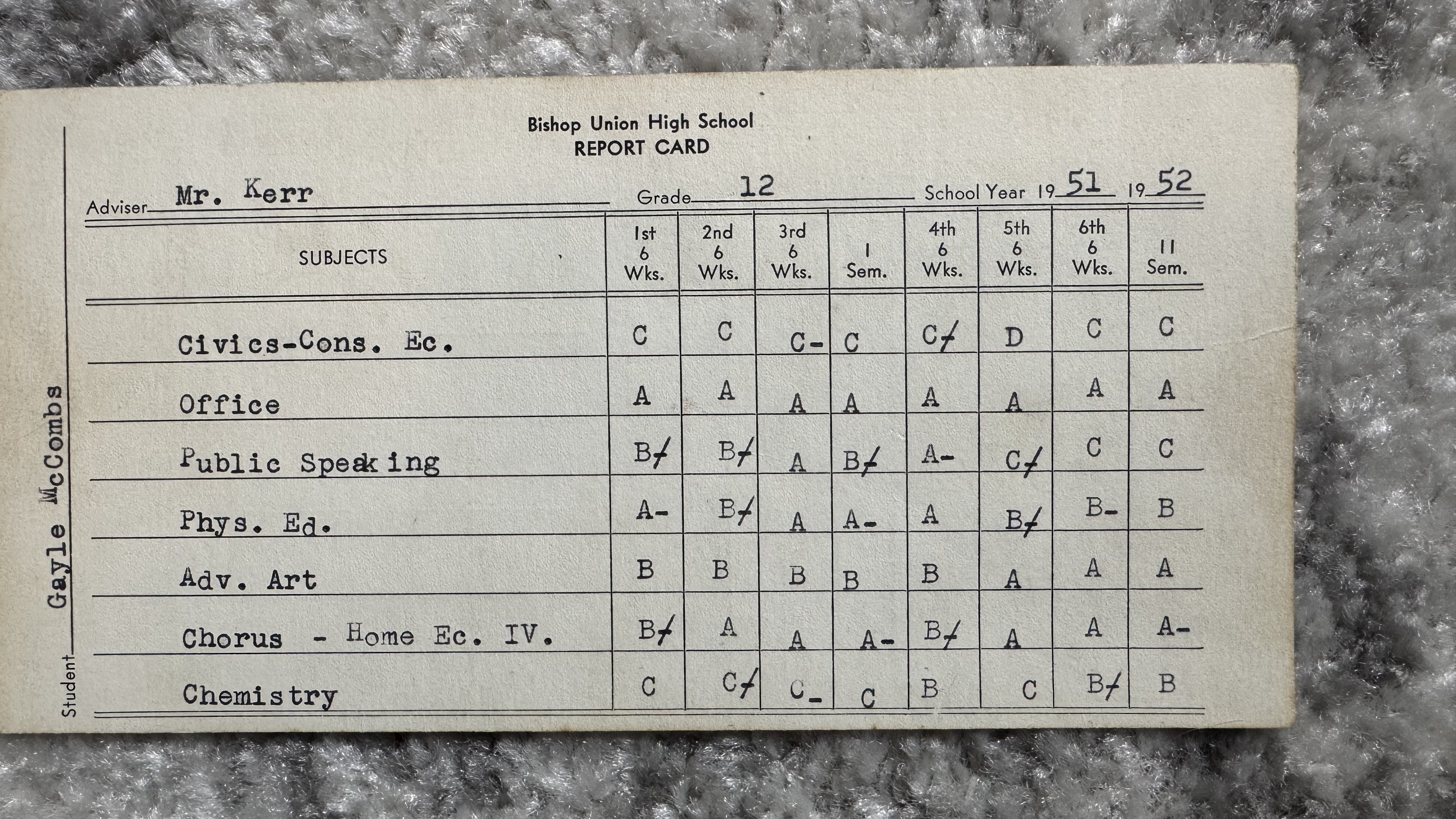 A handwritten high school report card from the early 1950s.